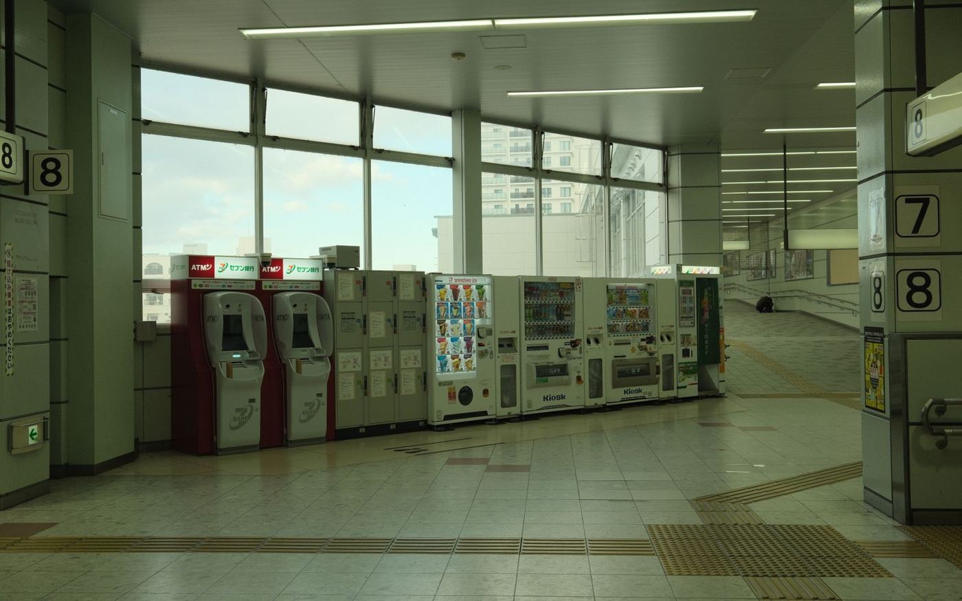 A row of vending machines in a busy public building